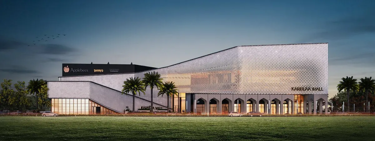 Evening render of a shopping mall with a perforated metal façade, arched arcade and palm trees